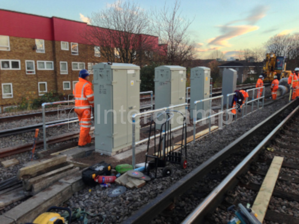 Railway construction site featuring a modular balustrade safety post system made with Interclamp key/tube clamp fittings, safeguarding workers from potential dangers.